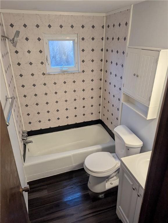 full bathroom featuring wood-type flooring, vanity, shower / bath combination, and toilet