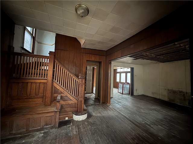 stairway featuring wood-type flooring