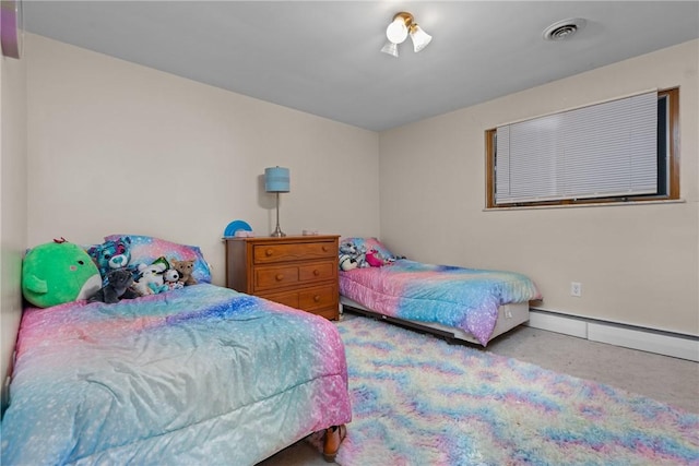 bedroom featuring carpet floors and a baseboard heating unit