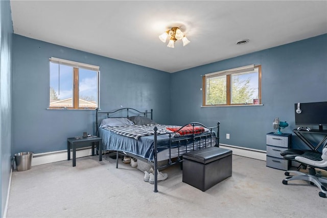 bedroom with carpet and a baseboard radiator