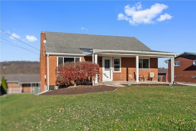 bungalow-style house featuring a front yard