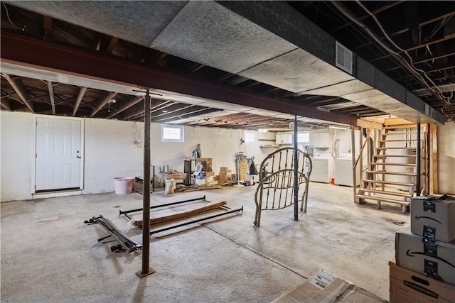 workout room featuring independent washer and dryer and plenty of natural light