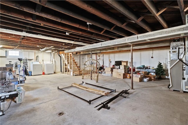 basement with separate washer and dryer and heating unit