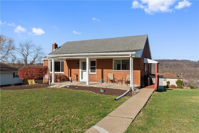 view of front of home with a front yard