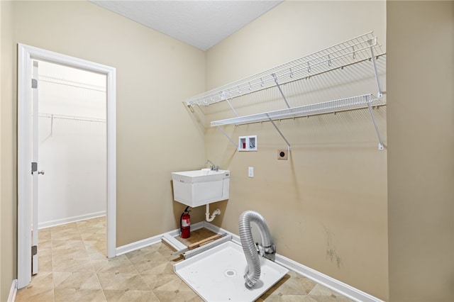 clothes washing area featuring electric dryer hookup and hookup for a washing machine