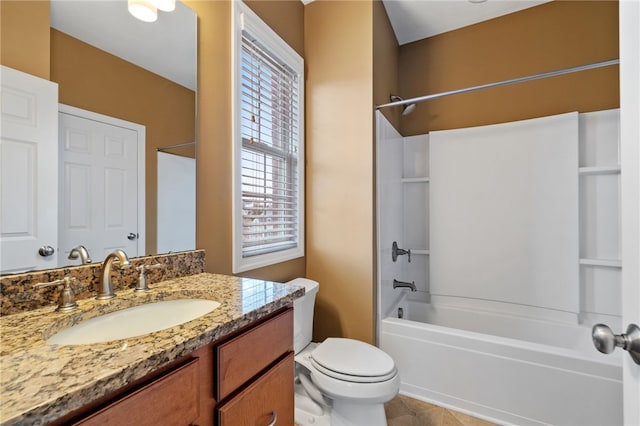 full bathroom with bathing tub / shower combination, vanity, and toilet