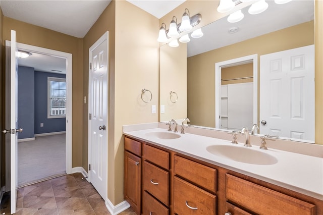 bathroom featuring tile patterned floors and vanity