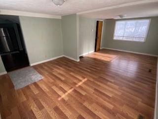 empty room with wood-type flooring