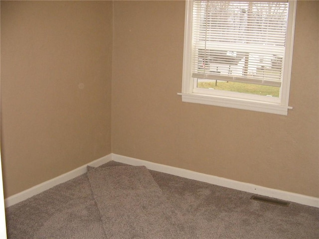 unfurnished room featuring carpet flooring