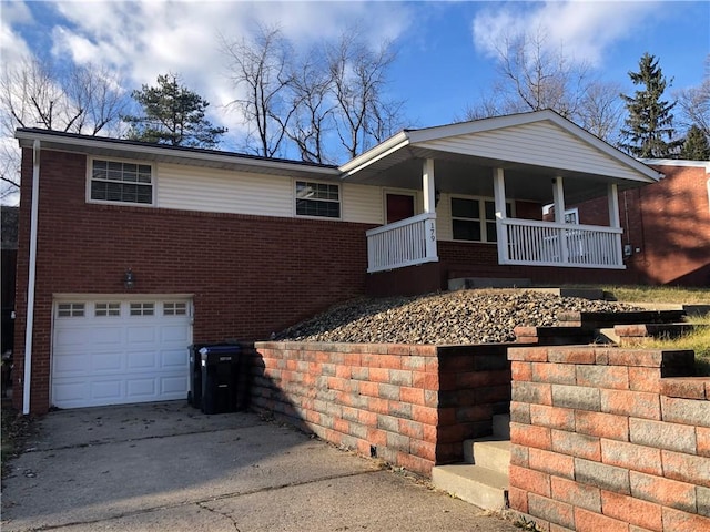 view of front of home featuring covered porch and a garage