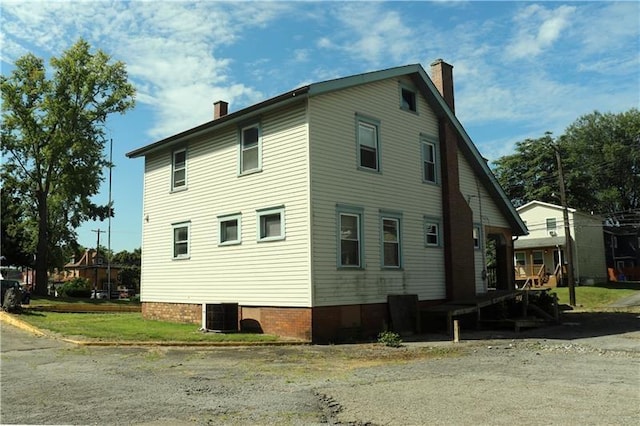 view of home's exterior with central air condition unit