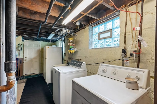 washroom with independent washer and dryer