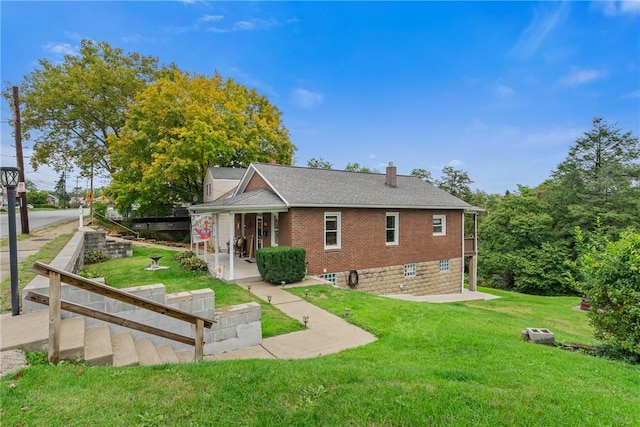 rear view of house with a lawn