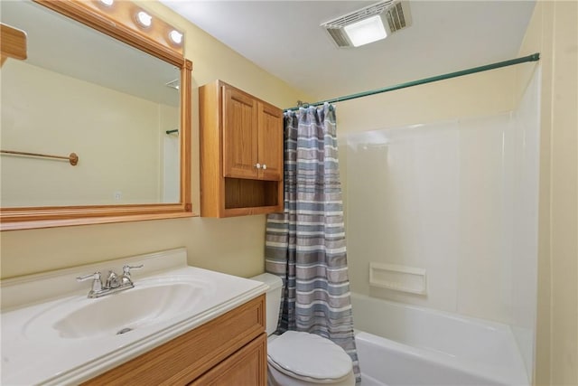 full bathroom featuring shower / bath combo with shower curtain, vanity, and toilet