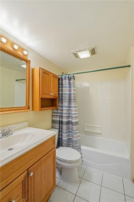 full bathroom featuring tile patterned flooring, vanity, toilet, and shower / tub combo