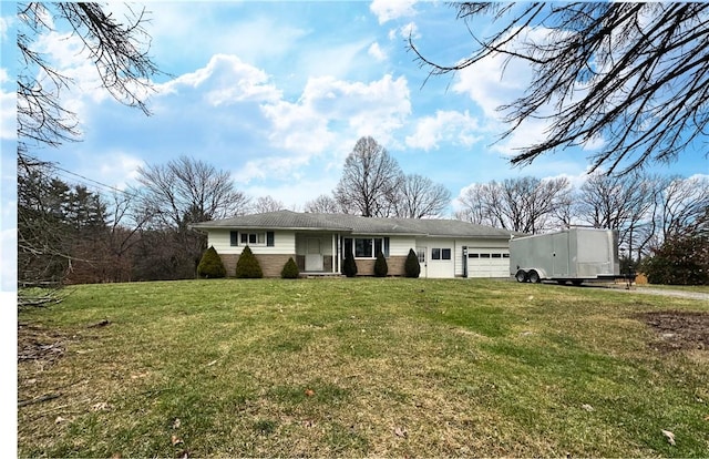 ranch-style home with a garage and a front lawn