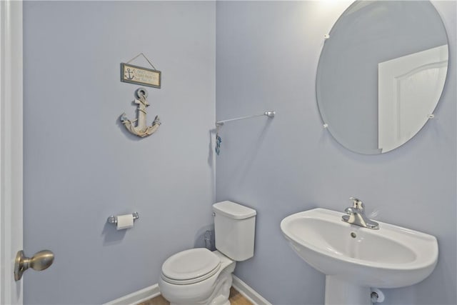 bathroom featuring sink and toilet