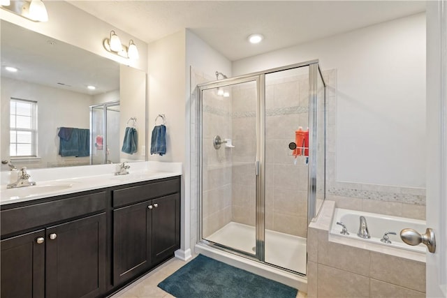 bathroom with separate shower and tub, tile patterned flooring, and vanity