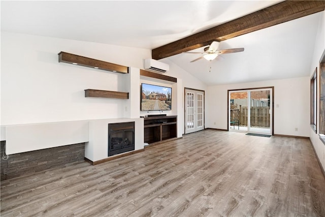 unfurnished living room featuring a wall mounted AC, ceiling fan, hardwood / wood-style floors, and vaulted ceiling with beams