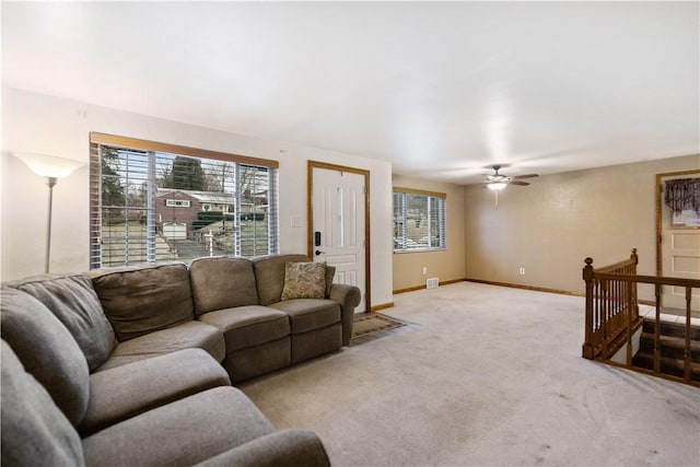 living room featuring light carpet and ceiling fan