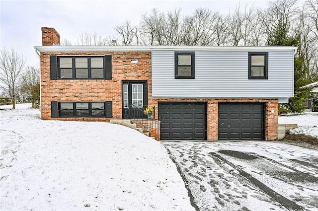 split foyer home featuring a garage