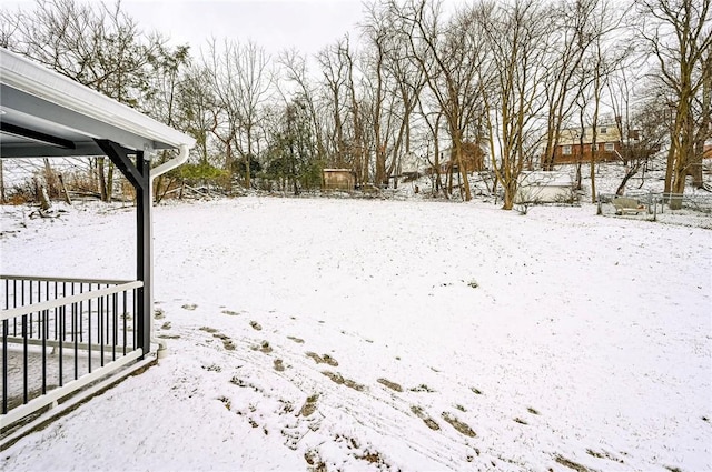 view of yard layered in snow