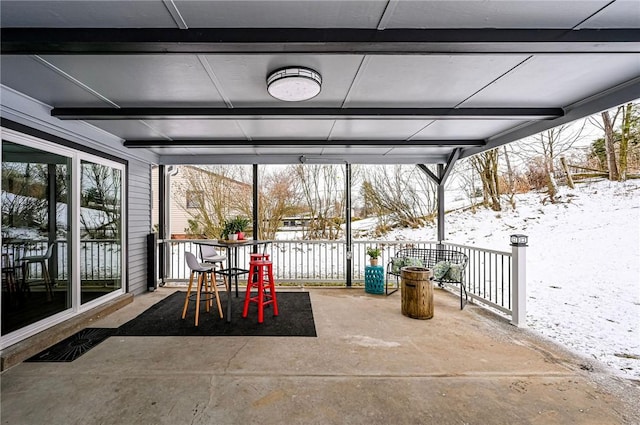 view of snow covered patio