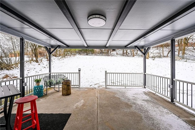 view of snow covered patio