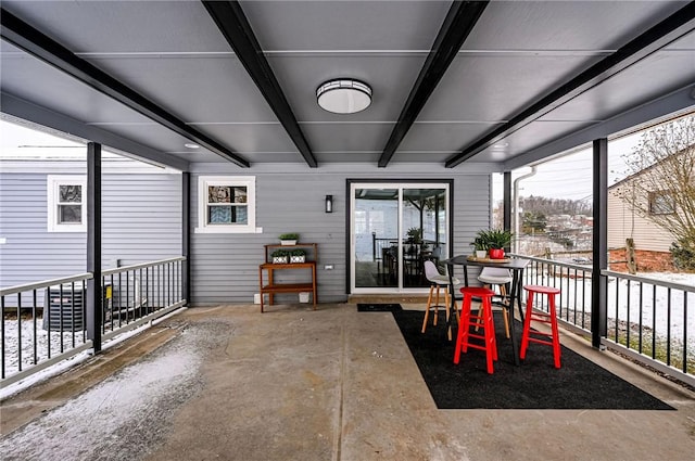 sunroom / solarium with beam ceiling