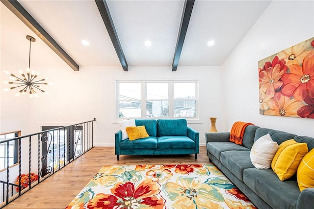 living room featuring beam ceiling, light hardwood / wood-style floors, and an inviting chandelier