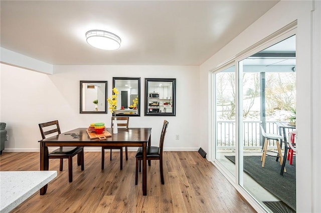 dining room featuring hardwood / wood-style flooring