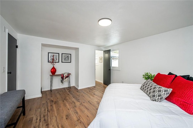 bedroom with wood-type flooring