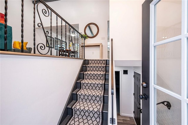 staircase featuring hardwood / wood-style floors