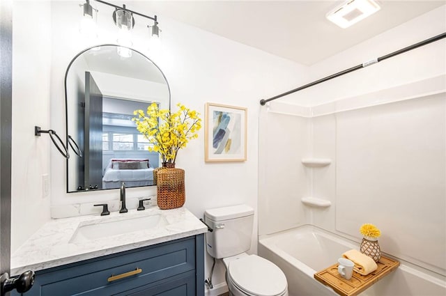 full bathroom with vanity, bathtub / shower combination, and toilet