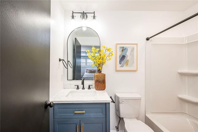 full bathroom with vanity, tub / shower combination, and toilet