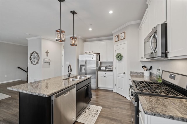 kitchen featuring white cabinetry, a center island with sink, stainless steel appliances, and sink