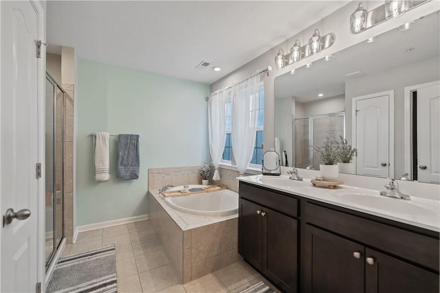 bathroom featuring tile patterned flooring, vanity, and independent shower and bath