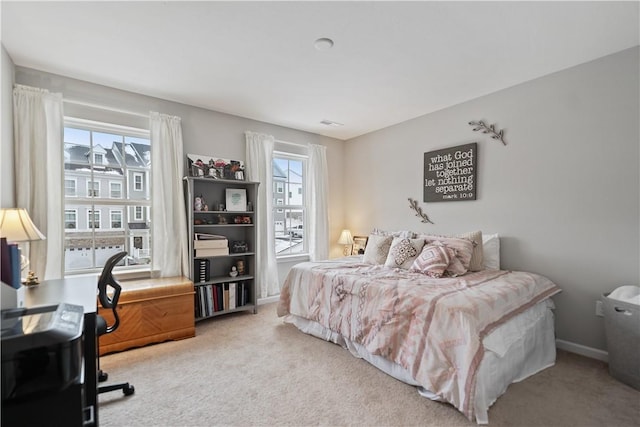 bedroom with light carpet