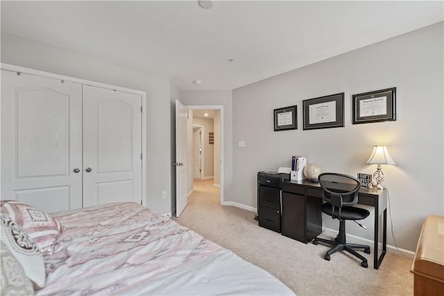 carpeted bedroom with a closet