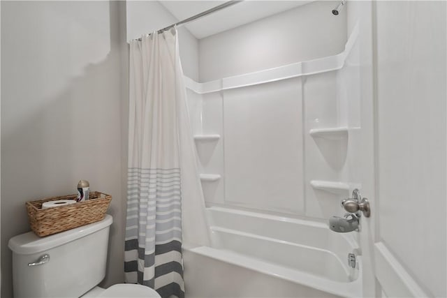 bathroom featuring toilet and shower / bath combo with shower curtain