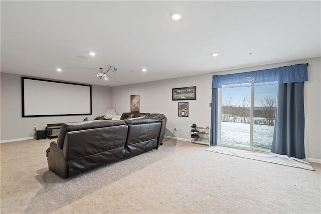 home theater room featuring light colored carpet