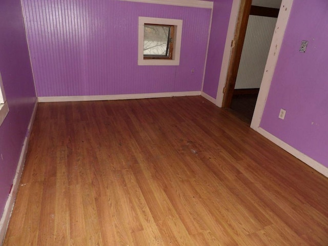 spare room featuring hardwood / wood-style floors