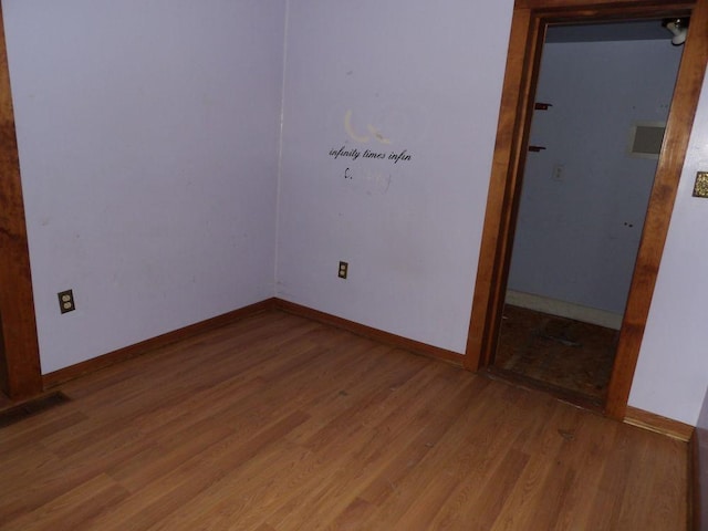 unfurnished room featuring hardwood / wood-style floors