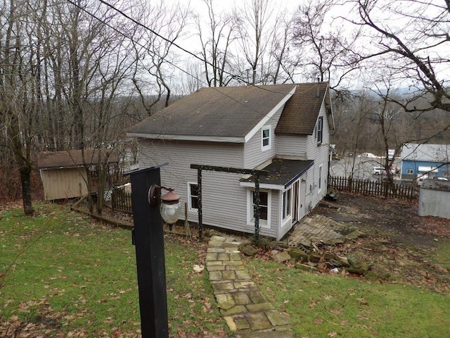 view of property exterior with a lawn