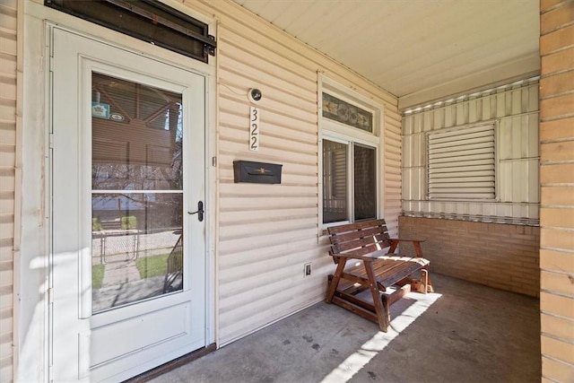 doorway to property with covered porch