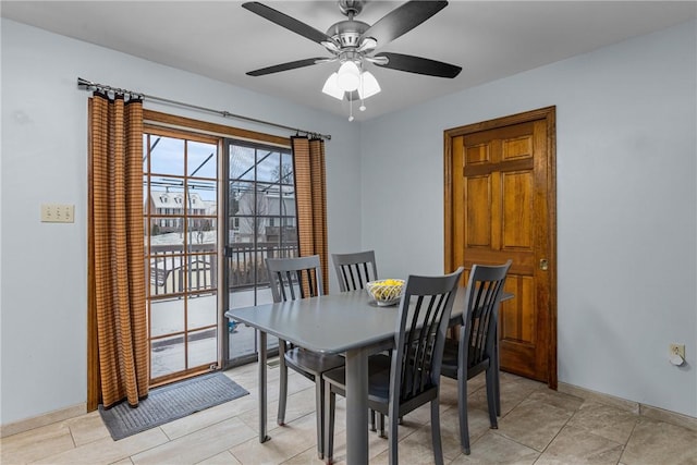 tiled dining room featuring ceiling fan