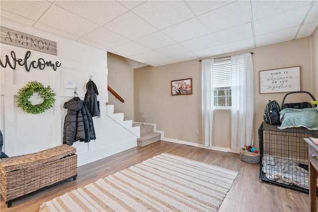 mudroom with a paneled ceiling and wood-type flooring