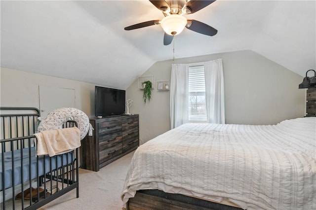 bedroom featuring light carpet, ceiling fan, and lofted ceiling