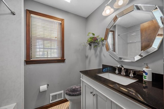 bathroom with vanity and toilet