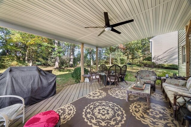 view of patio with ceiling fan, a deck, and an outdoor hangout area